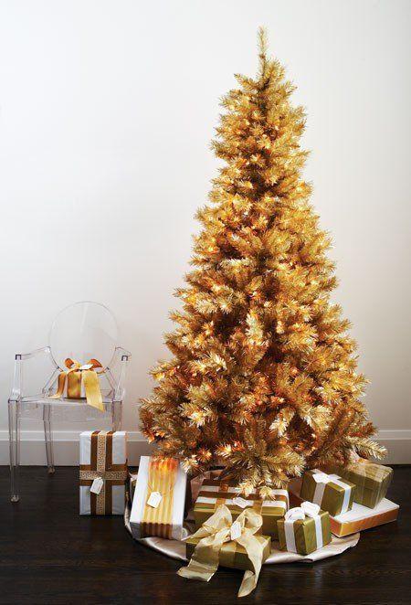 Front door entrance featuring a thick wreath made of champagne and gold metallic ornaments.
