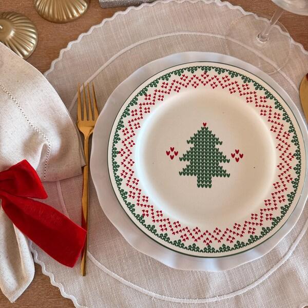 Cozy dining nook, woodland scene plates, earth-toned decor, pinecone centerpiece, warm soft lighting.