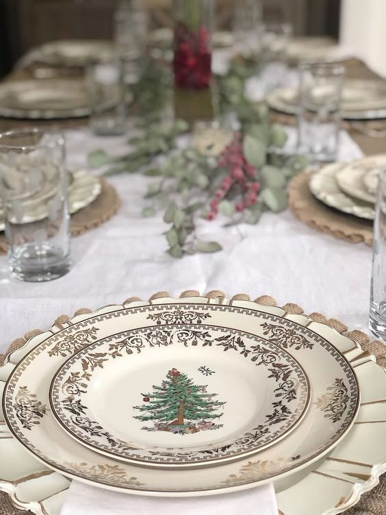 Traditional dining, tartan rimmed china, wool tablecloth, rustic wood, candlelight, warm festive atmosphere.