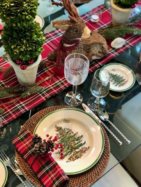 Living room, antique ornaments, mismatched china, layered rugs, rich colors, eclectic holiday decor.