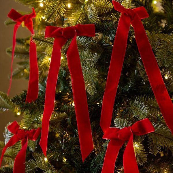 Asymmetrical pine garland with wooden accents creating cozy organic christmas decorating trends.
