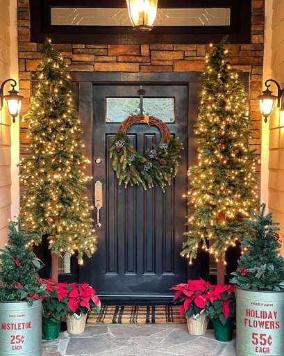 A fireplace mantel styled with an assortment of silver and gold mercury glass ornaments.