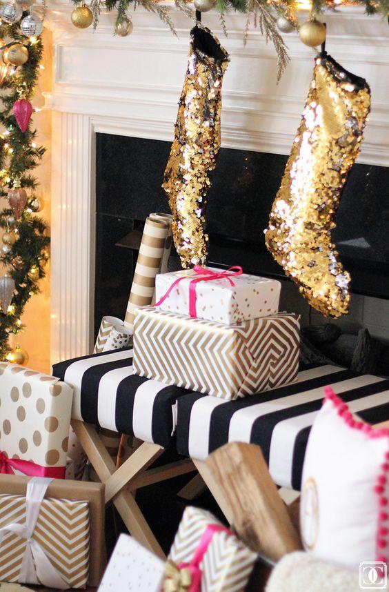 Rolling bar cart styled with gold christmas decor, crystal glassware, and festive gold ornaments.