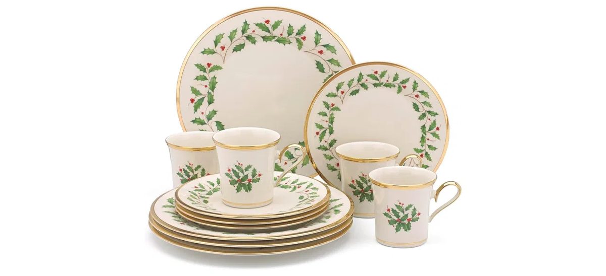 Charming christmas china pattern featuring colorful vintage toy illustrations on scalloped-edge plates.