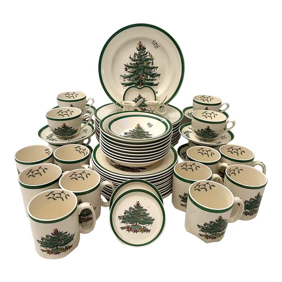 Sophisticated christmas china pattern featuring a snowy village scene on a navy blue background.
