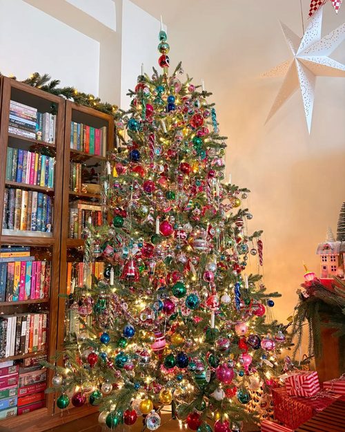Coastal christmas tree decorated with aqua ornaments, sea glass, and coral reefs christmas decorating trends.