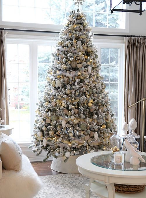 Vibrant living room filled with jewel-tone christmas ornaments, velvet drapery, and bold christmas decorating trends.