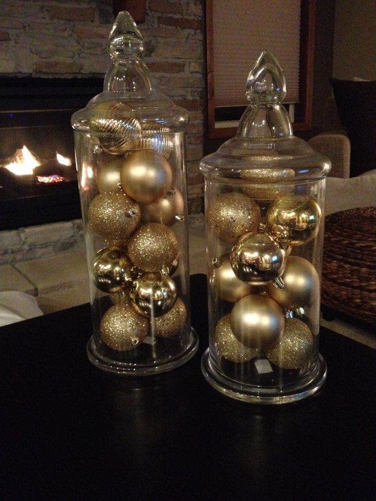 Small powder room styled with gold christmas decor, gold mirror, and festive hand towels.