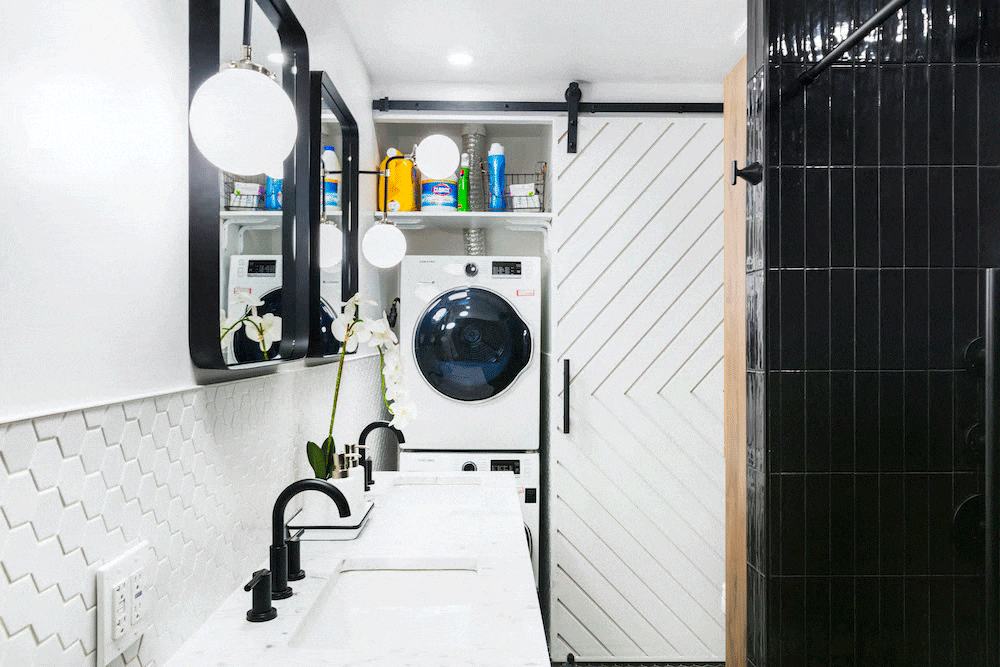 Compact bohemian apartment laundry space with rattan cabinet doors terracotta tile and hanging trailing plants