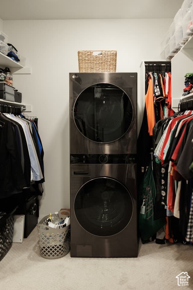 European small laundry corner with picture frame wall moulding, marble countertop, soft brass sconce light.