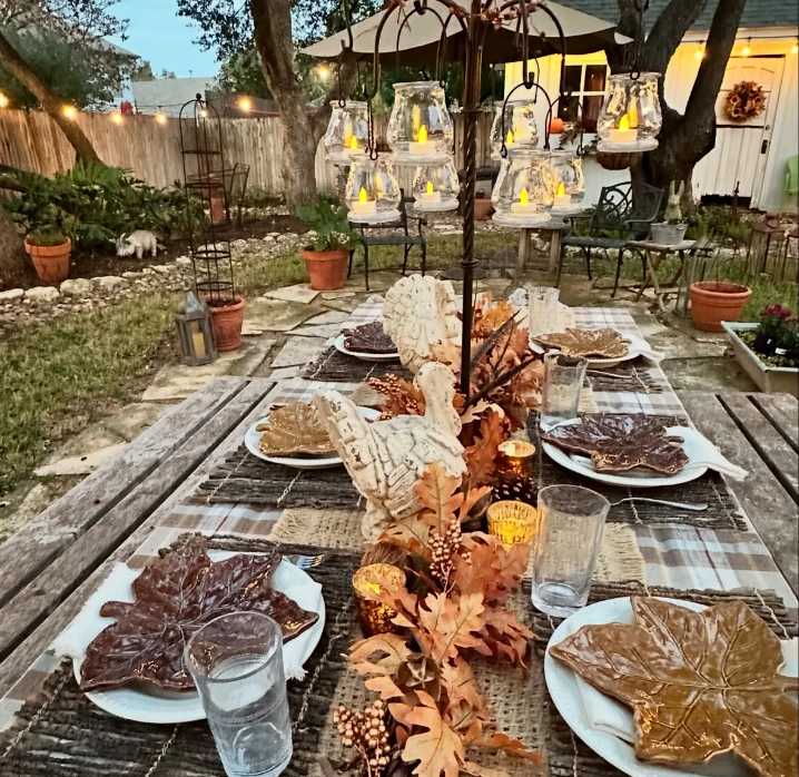 Outdoor patio, plaid table runner, mason jar candles, soft teal, natural wood bench