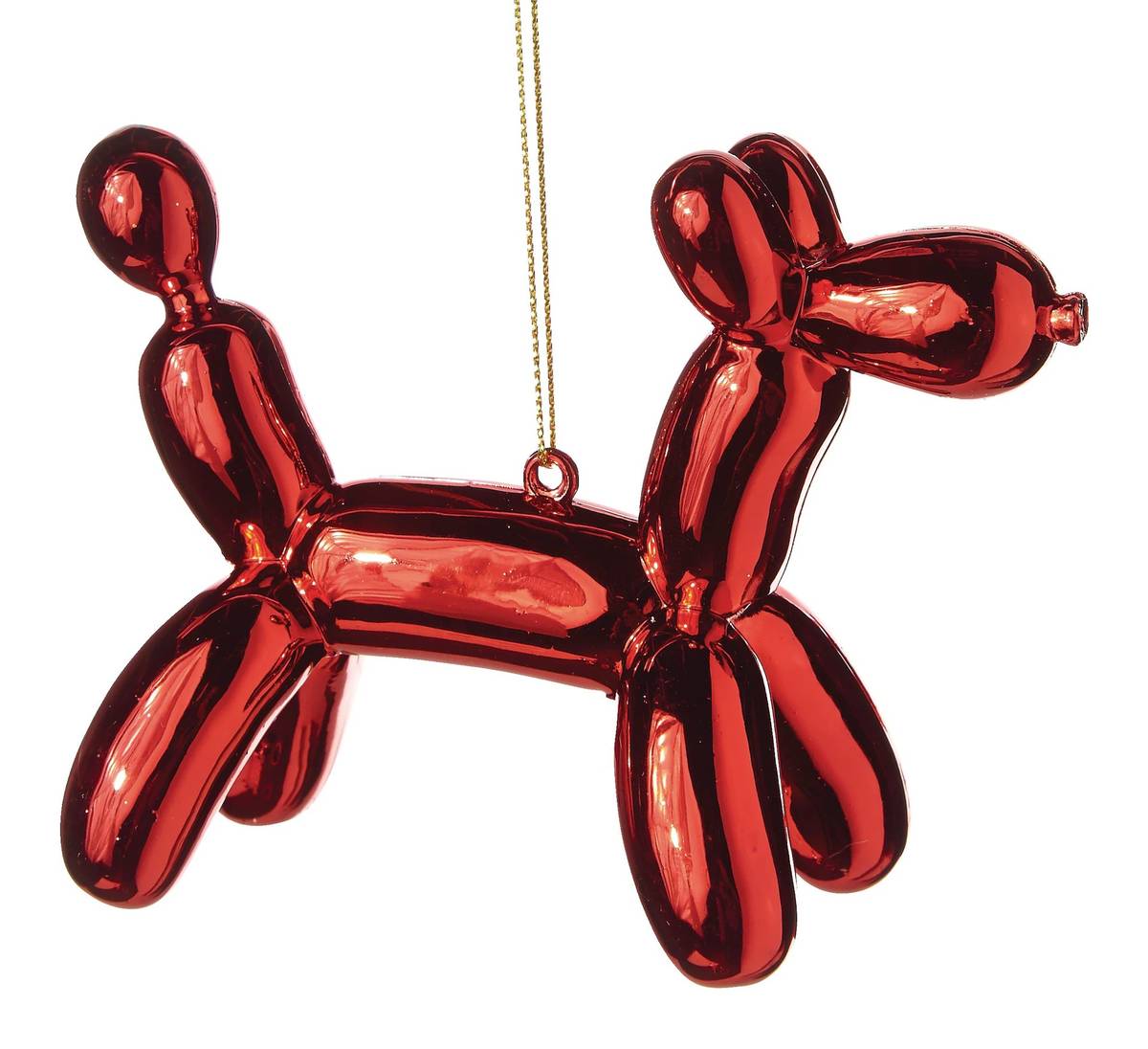 Traditional pine christmas tree decorated with luxury metallic gold balloon poodle ornament and warm lights.