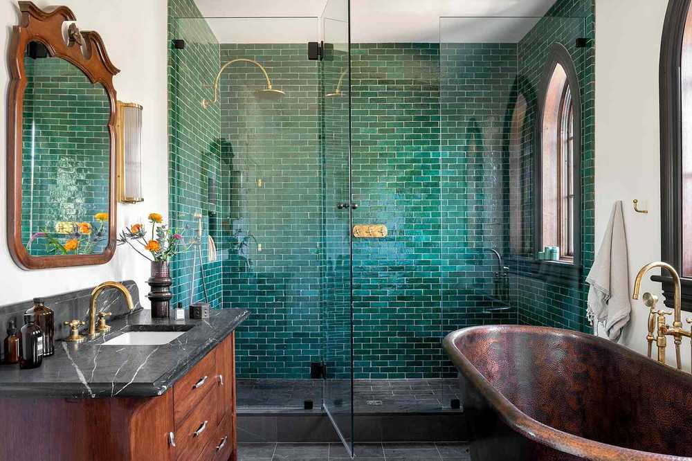 Spa bathroom filled with lush indoor plants and natural stone textures for organic appeal.