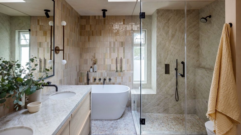Minimalist bathroom featuring polished concrete walls and a stone vessel sink.