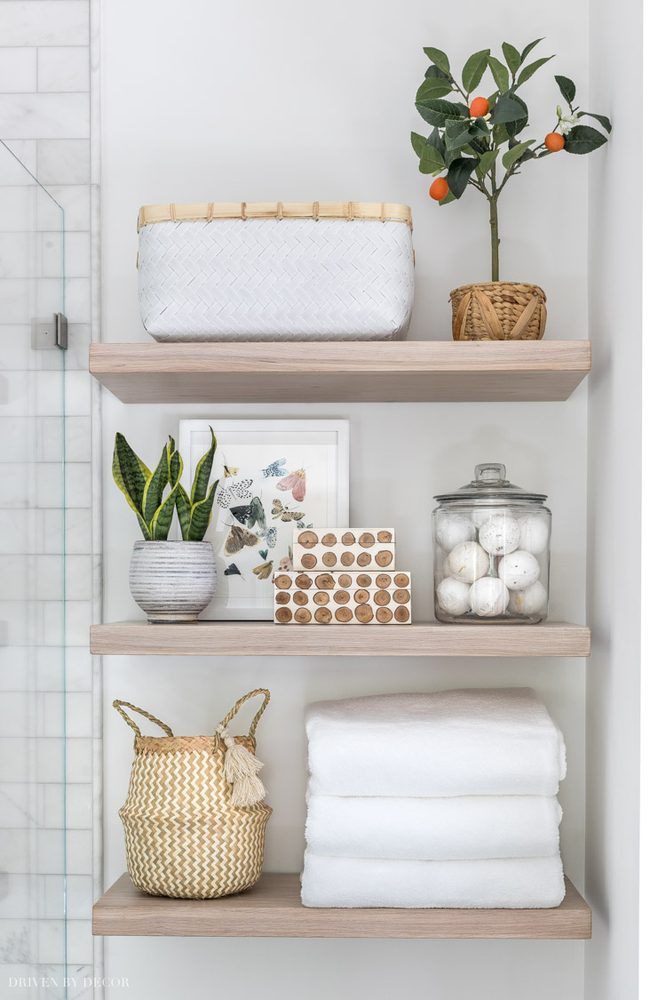 Spa bathroom designed with light oak wood, clean lines, and neutral beige tones.