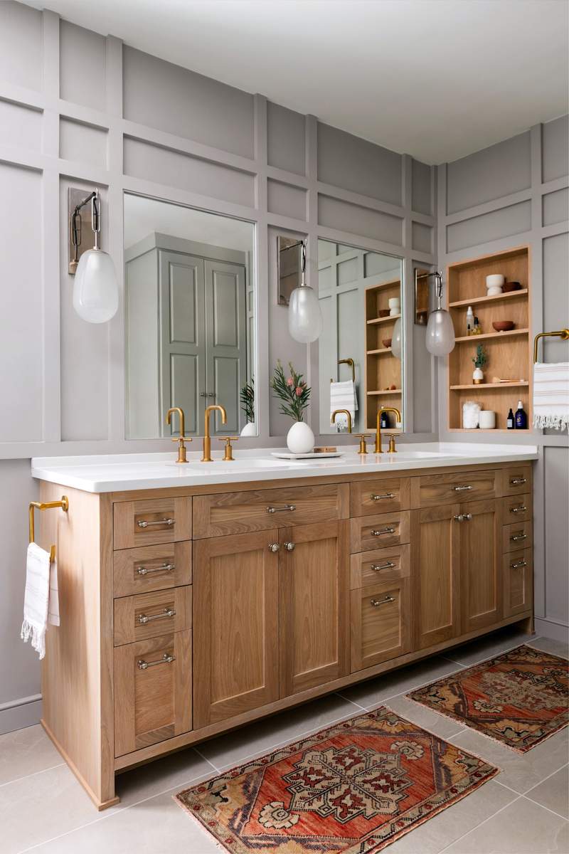 Farmhouse bathroom with a reclaimed wood mirror, white shiplap walls, and copper fixtures.