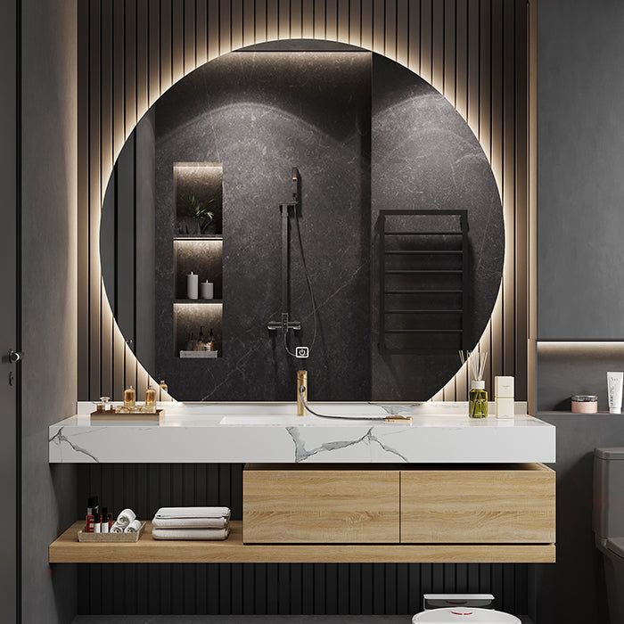 A round bathroom mirror suspended by a thick nautical rope in a coastal bathroom.