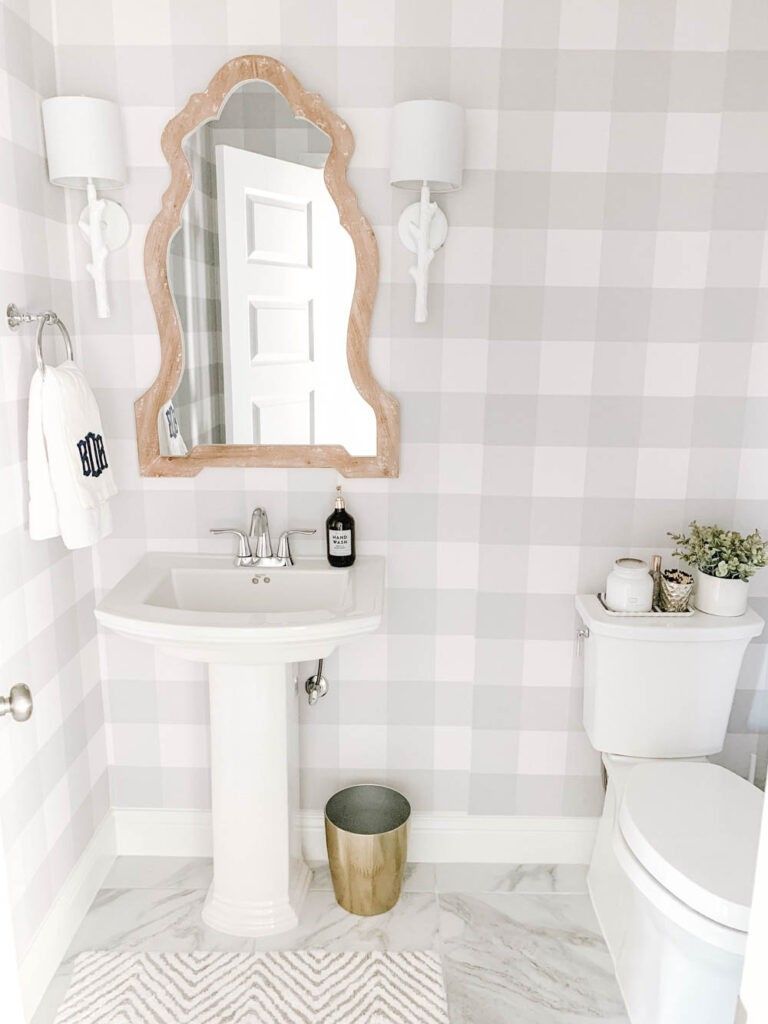 Gray gingham check bathroom wallpaper with rustic farmhouse decor and clean white vanity accents.