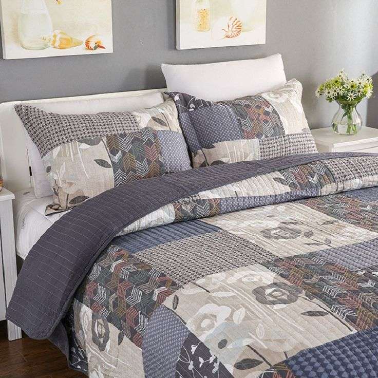 Elegant master bedroom showcasing charcoal gray velvet comforter, silk pillowcases, moody recessed lighting, upholstered headboard