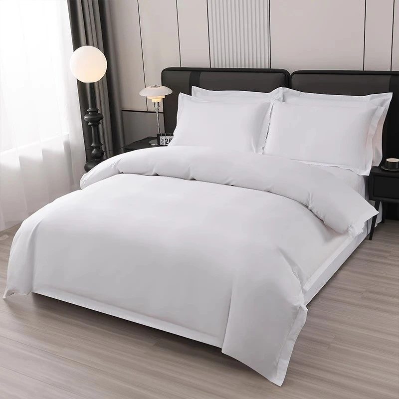 Modern minimalist bedroom with slate grey bedding set, matte black upholstered headboard, ambient strip lighting.