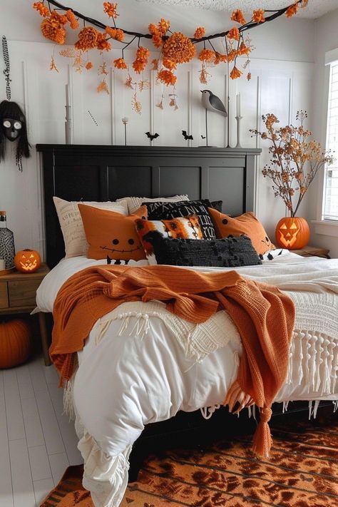 Bedroom with black headboard, orange floral branch mobile, and pumpkin vase decor.