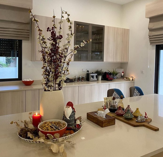 Tray with candles and crushed candy canes on the kitchen island.