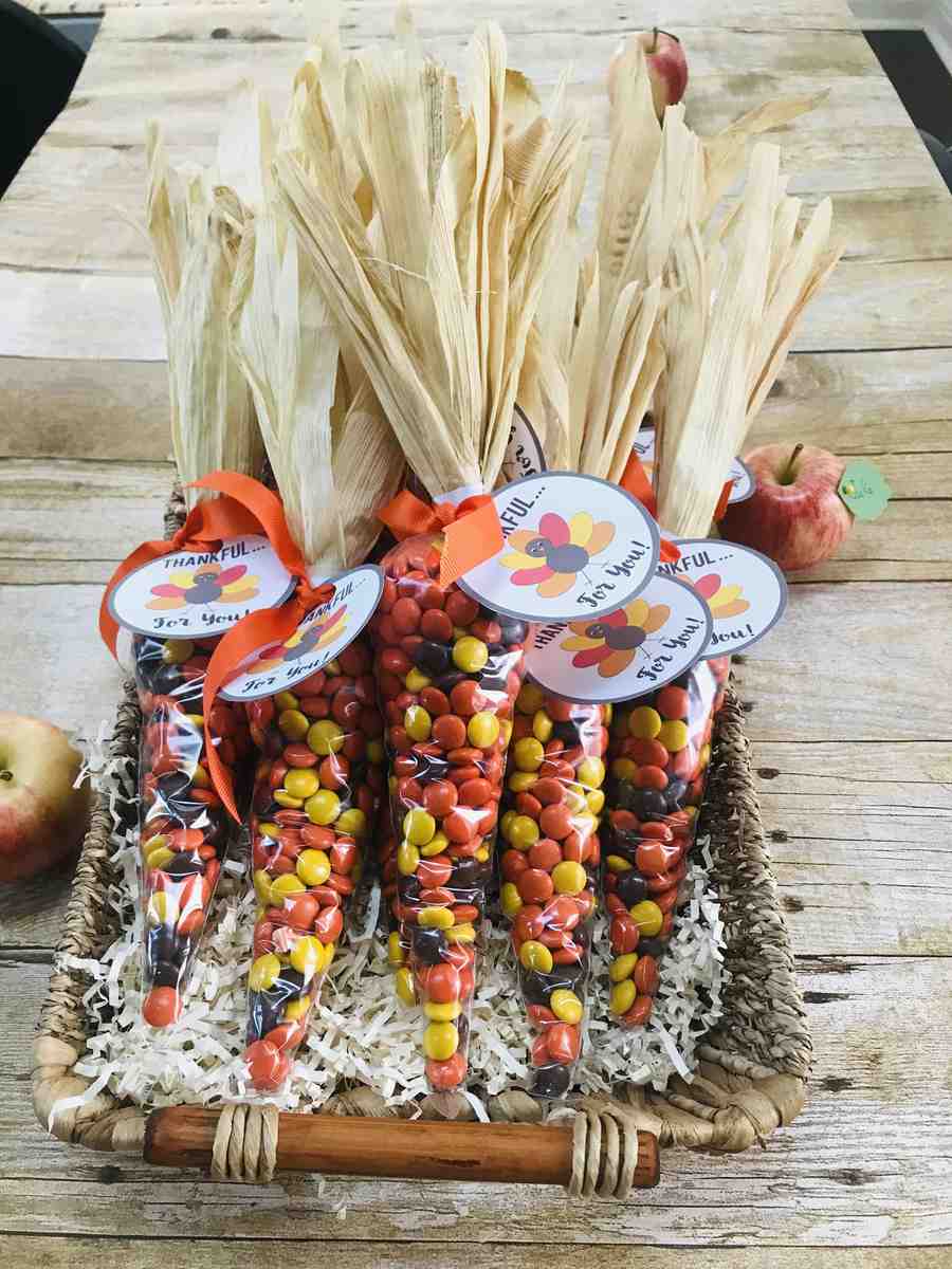 Kitchen island, candy‑filled cornucopia, assorted treats, pastel lighting, white countertop.