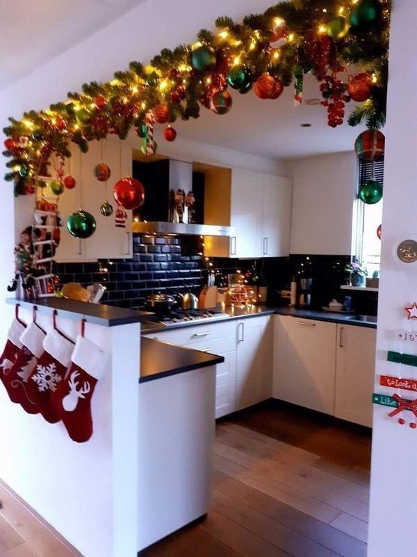String of warm white fairy lights draped across the kitchen ceiling.