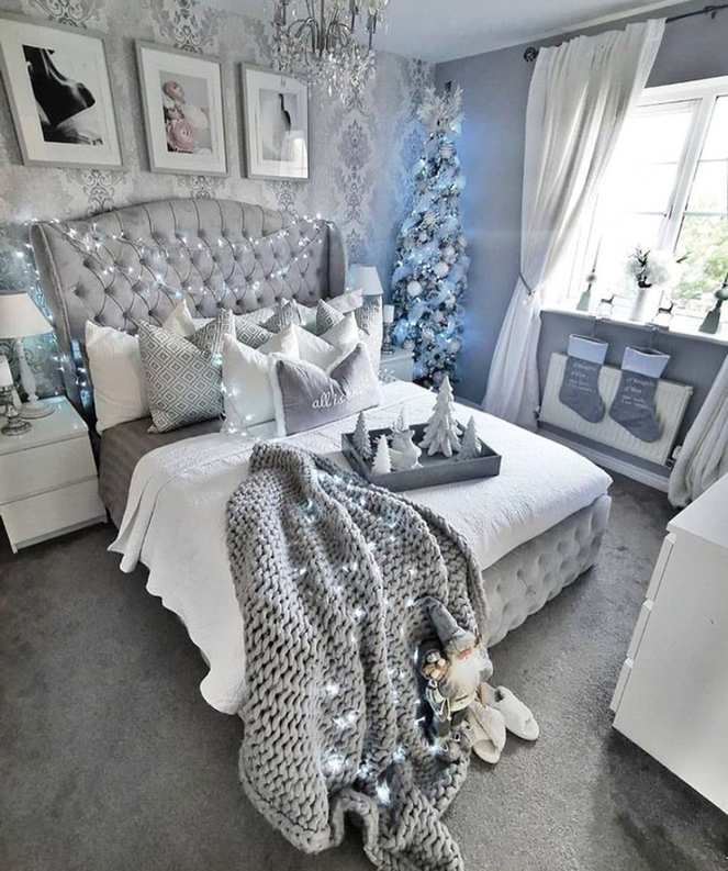 Organic bedroom with sage green walls, wooden furniture, and natural textures