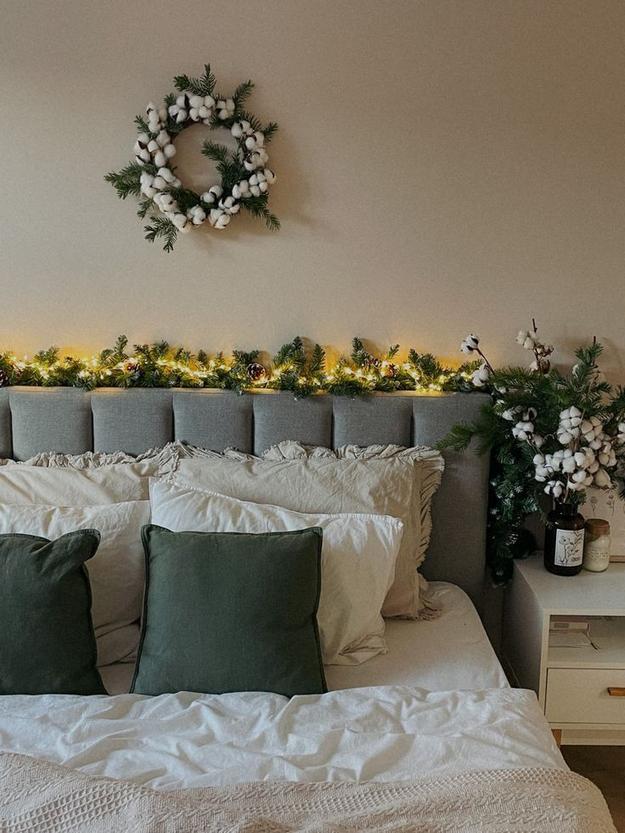 Earthy bedroom with rust walls, cream accents, and beige bedding