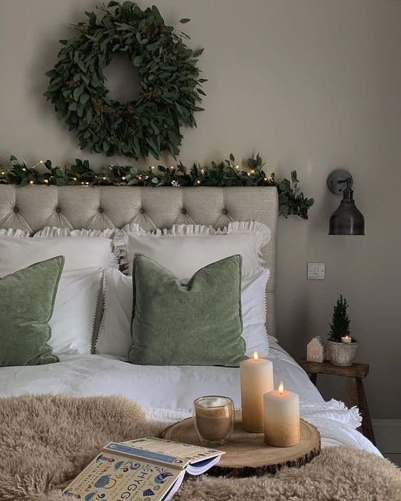 Elegant bedroom with navy blue walls, gold accents, and white bedding