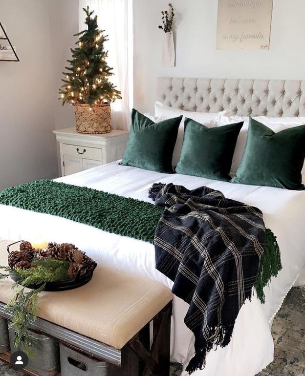 Calming bedroom with lavender walls, silver accents, and soft white bedding