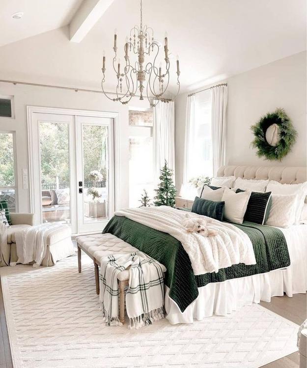 Vibrant bedroom with cobalt walls, gold accents, and white bedding