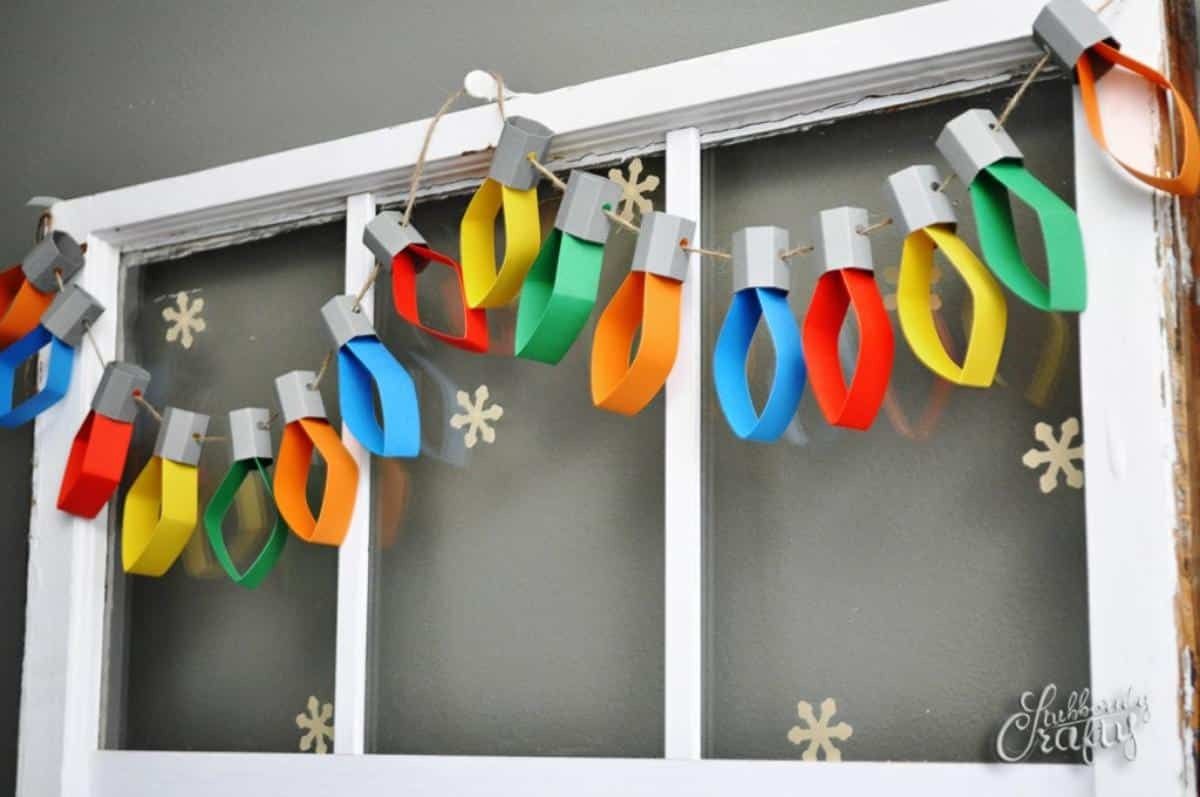 Kid-friendly living room space with colorful paper chain garland, wood coffee table, bright decor.
