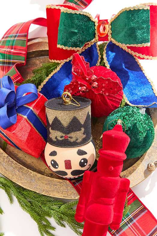 Bedroom with coral pink bedding, white walls, soft natural light