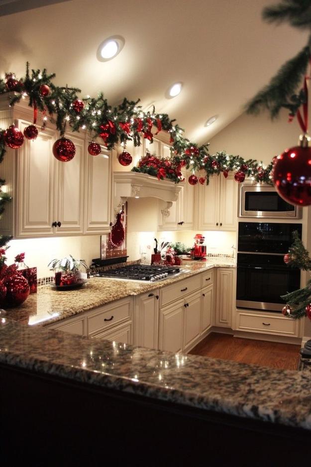 Kitchen with white shaker cabinets, clustered glass jars with tealight candles, soft warm lighting, intimate holiday glow