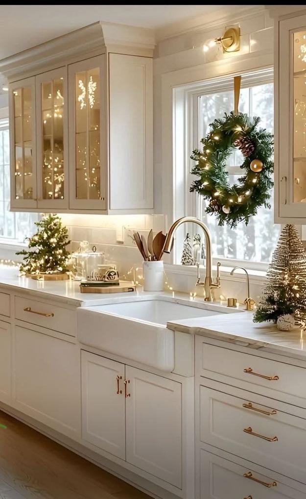 Kitchen with charcoal gray cabinets, brushed nickel cable lights, warm ambient glow, modern festive illumination