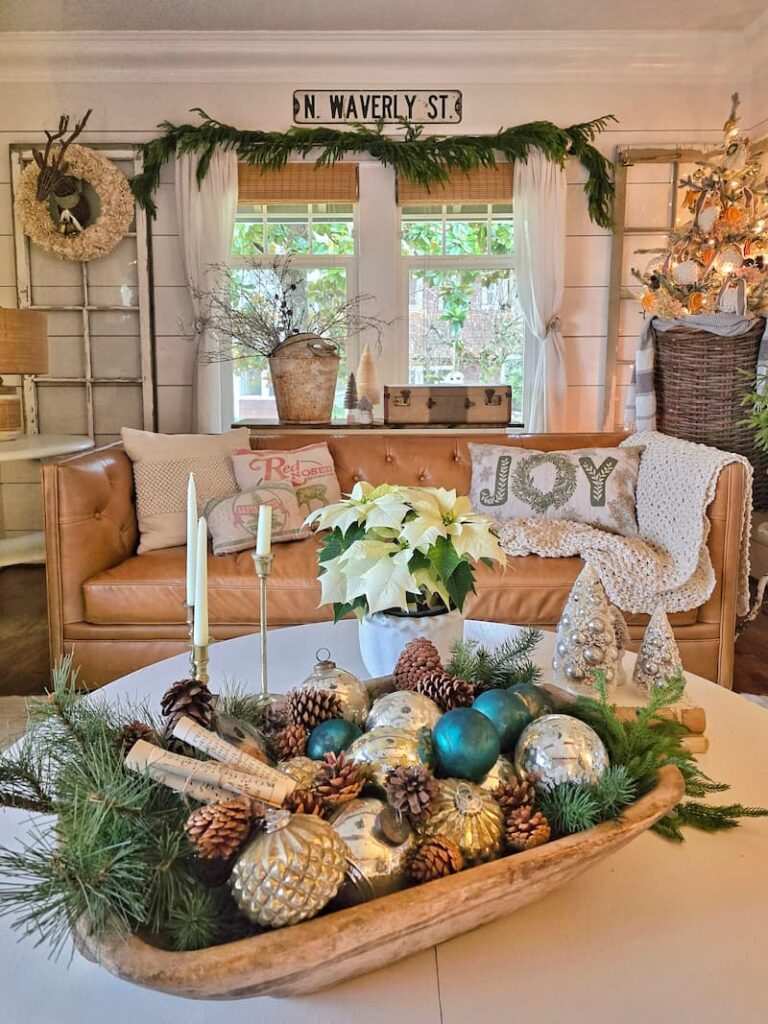 Modern dining sideboard featuring glass cloche ornament displays, dark walnut table, golden ambient lights.