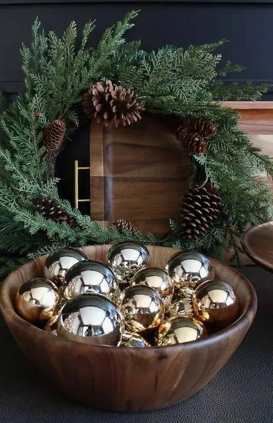 Built-in library bookshelves, ornaments tucked between books, gold bookends, moody navy walls.
