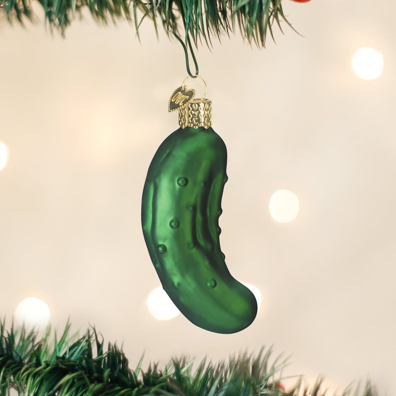 A sophisticated velvet mantle decor set with gold accents and a hidden pickle ornament.