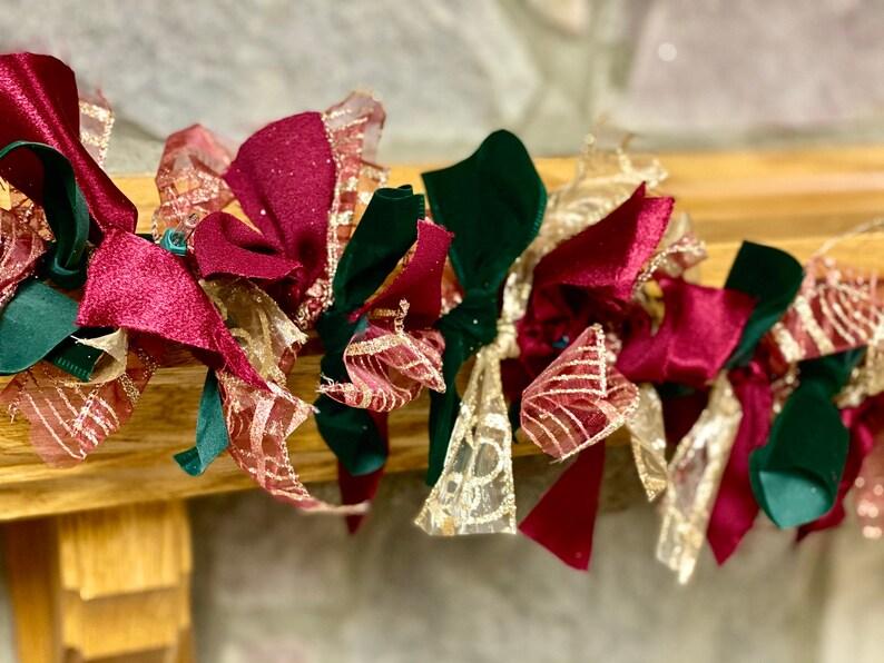 Antique glass ornaments suspended from Christmas tree branches using slim rust taffeta ribbon loops