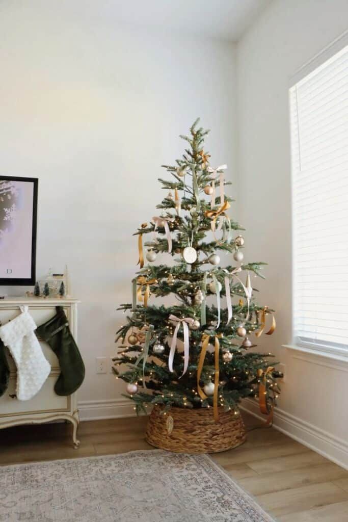 Elegant living room, Christmas tree with silk ribbon bows, pale pastel ornaments, subtle lighting