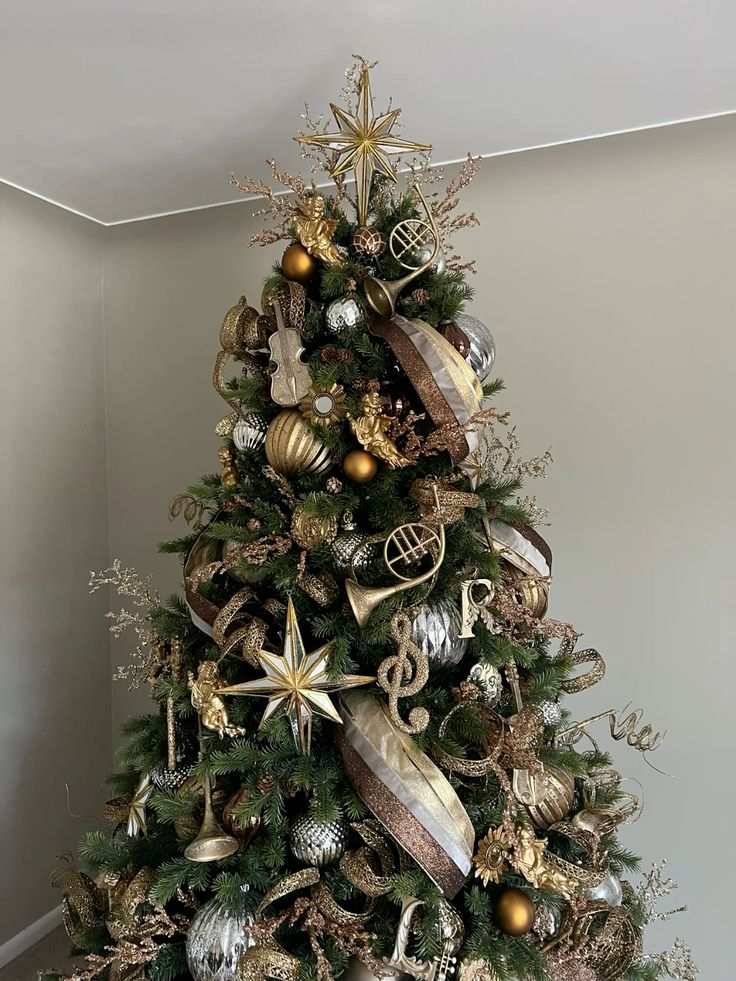 Grand living room, Christmas tree with gold ribbon, French horn ornaments, angel figurines, regal lighting