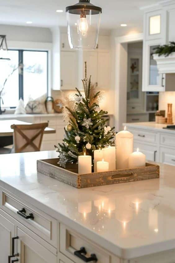 Small artificial Christmas tree with white lights on a corner of the kitchen counter.