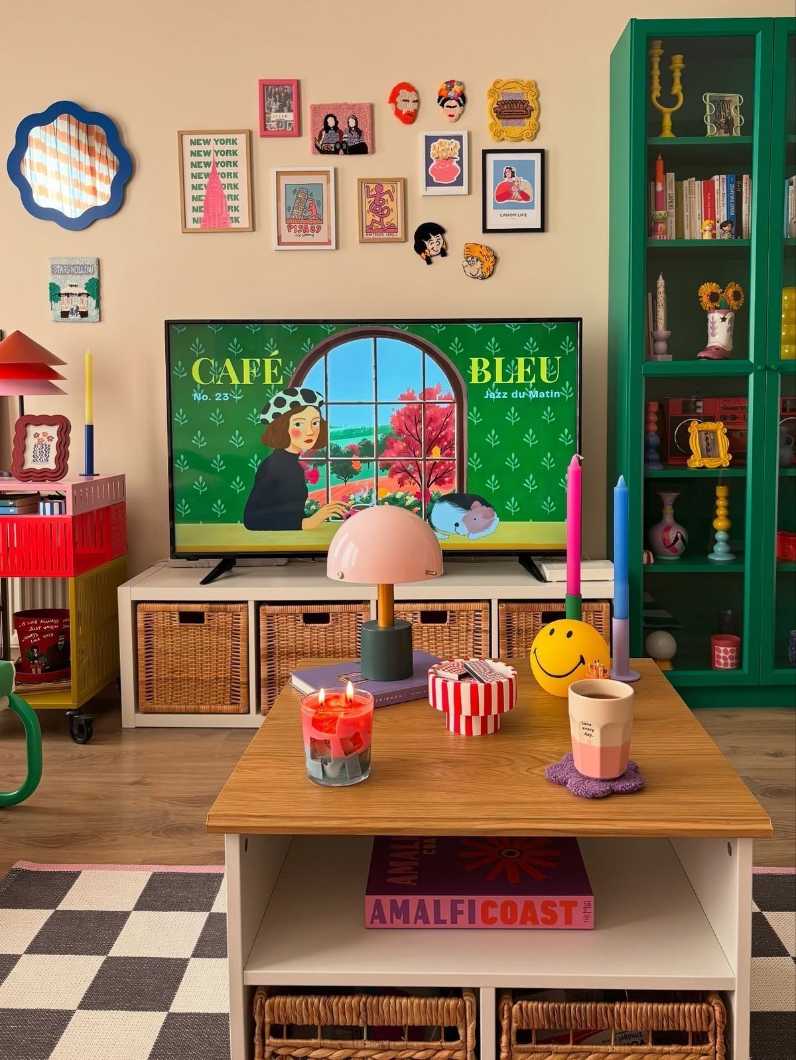 Retro TV stand with a vintage television and colorful decor.