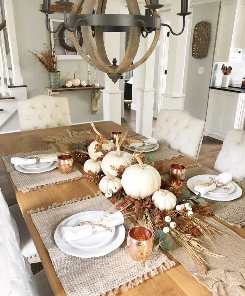 Modern loft dining, copper mugs, white ceramic pumpkins, slate table, cool white lighting