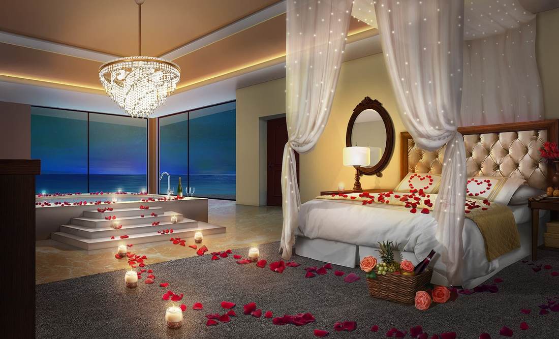 Boho master bedroom with woven rattan headboard, raw timber furniture, ivory cotton bedding, warm globe lights.