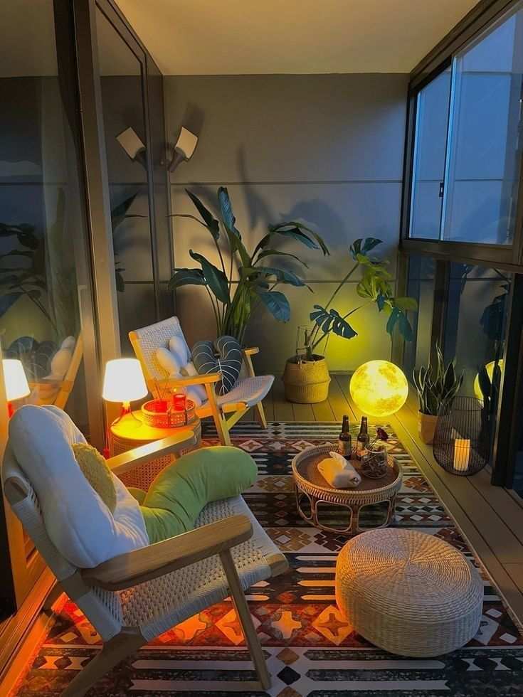 Night balcony with a glowing moon lamp, sleek lounge chairs, and soft teal accents.