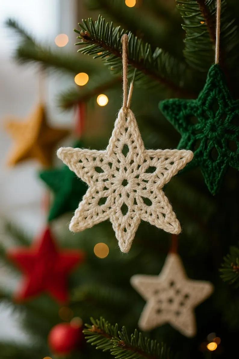 Bright dining room window with white lace crochet snowflake ornaments hanging from a brass curtain rod.