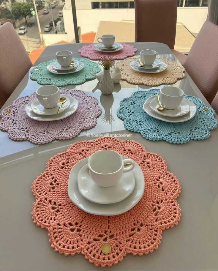 Living room coffee table with crochet table decorations, mandala mats, gold accents, bright lighting.